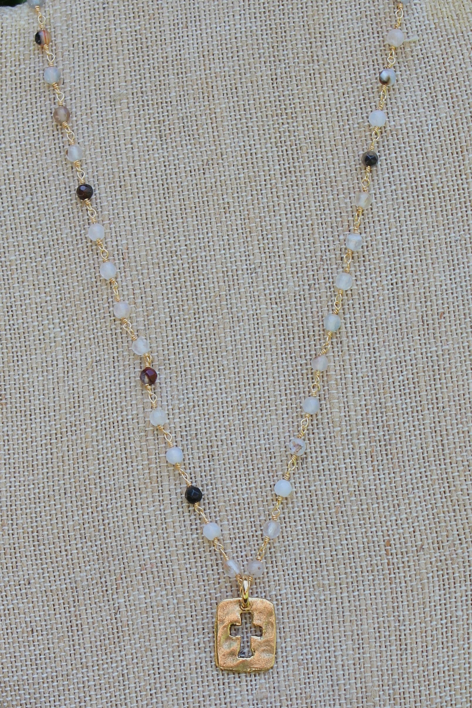 N109GB; Small Goldtone Open Cross; 3mm Black Agate Goldtone Chain; Approximately 17 inches; ; ; ; Majestees