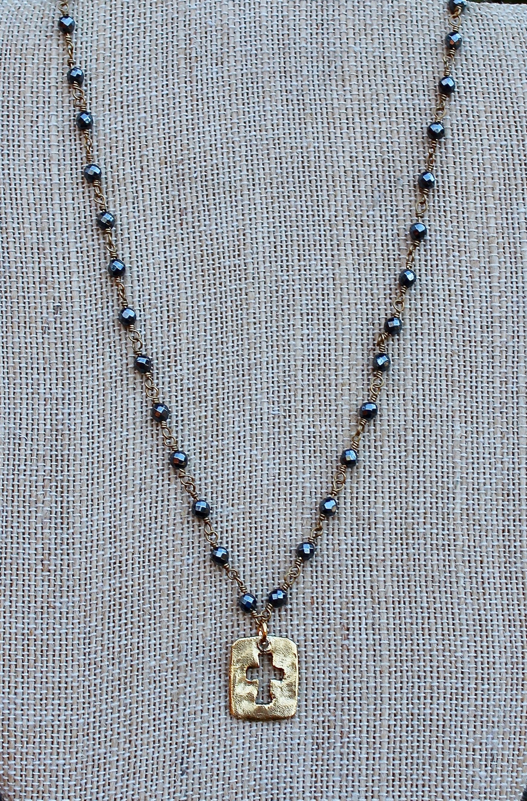 N109GH; Small Goldtone Open Cross; 3mm Goldtone Hematite Chain; Approximately 17 inches; ; ; ; Majestees