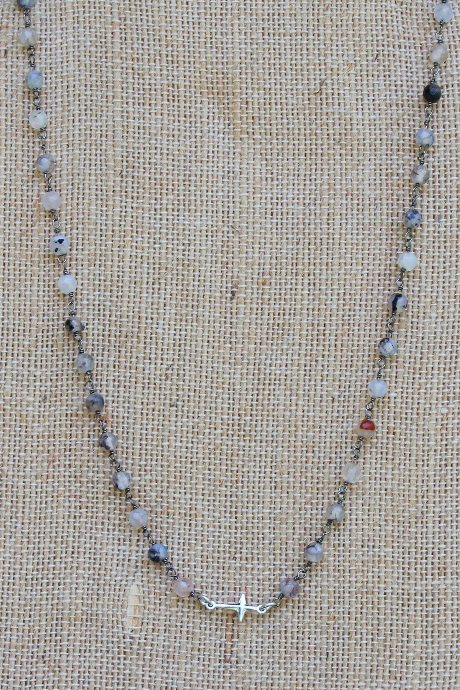 N112S; Tiny Silvertone Cross; 3mm Black Agate Silvertone Chain; Approximately 16 inches; ; ; ; Majestees
