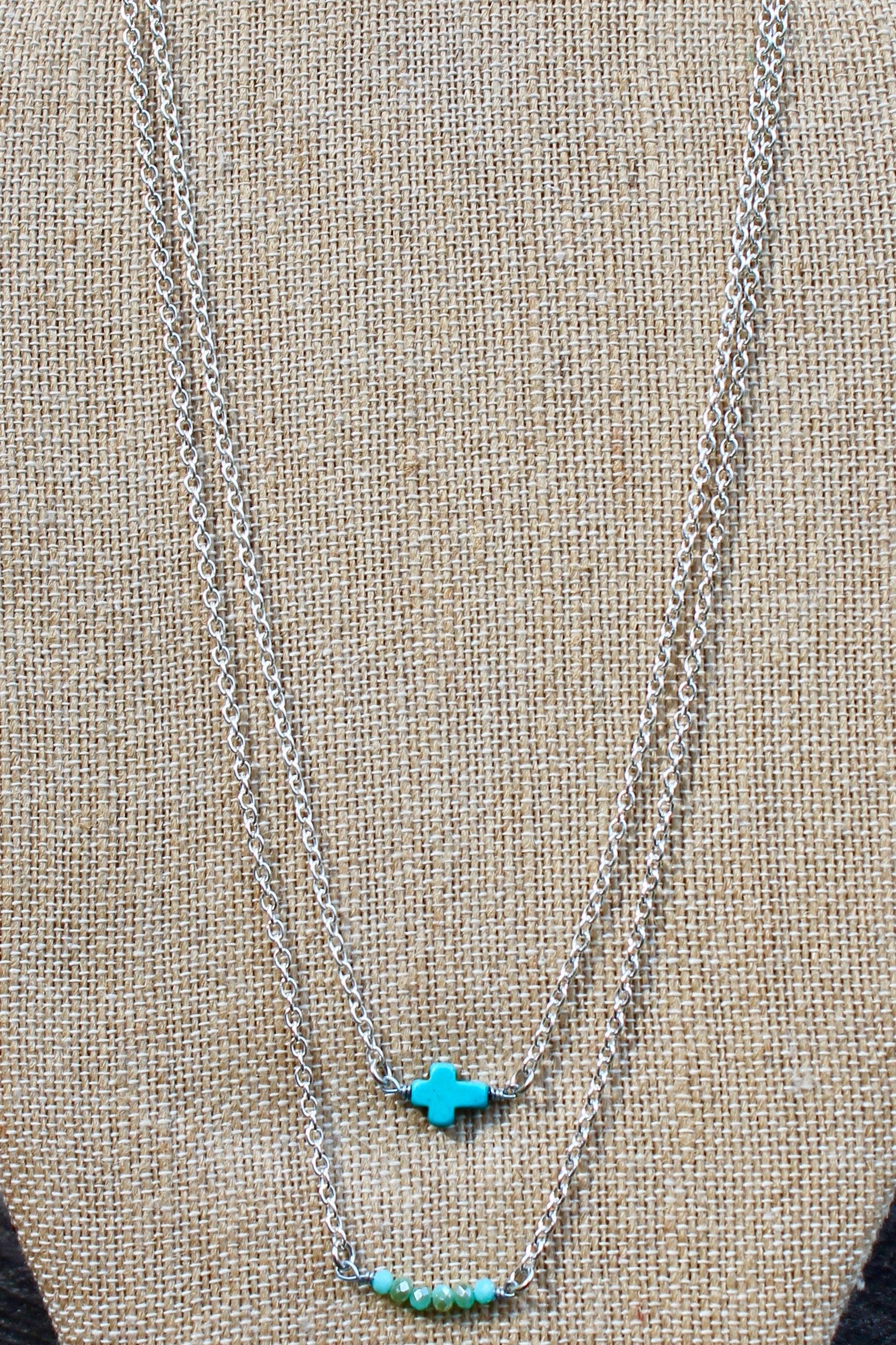 N126ST; Turquoise Stone Sideways Cross; Wired with Double Silvertone Chain; Approximately 16 inches; ; ; ; Majestees