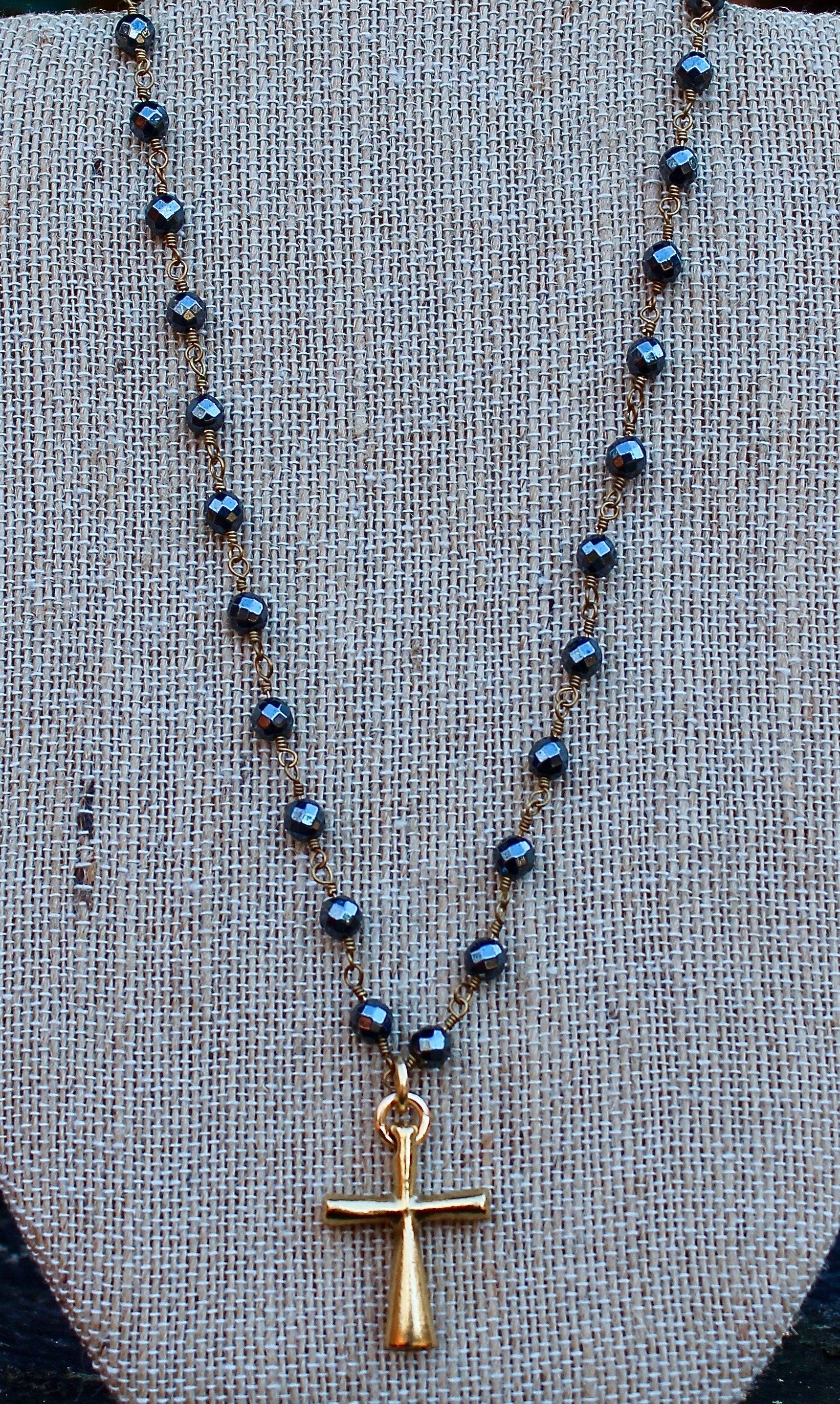 N127GH; Tubular Goldtone Cross; 5mm Goldtone Hematite Chain; Approximately 16 inches; ; ; ; Majestees