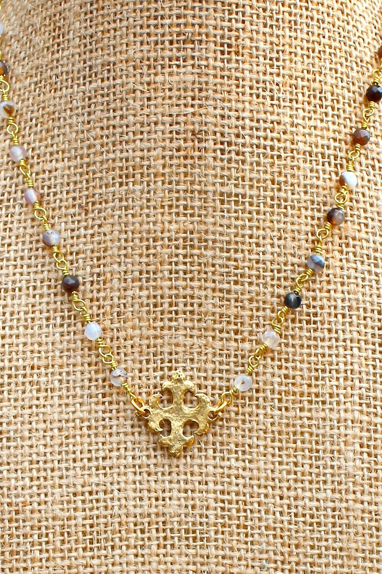N129GB; Hammered Goldtone Fleur-de-lis Cross; 3mm Goldtone Black Agate Chain; Approximately 16 inches; ; ; ; Majestees