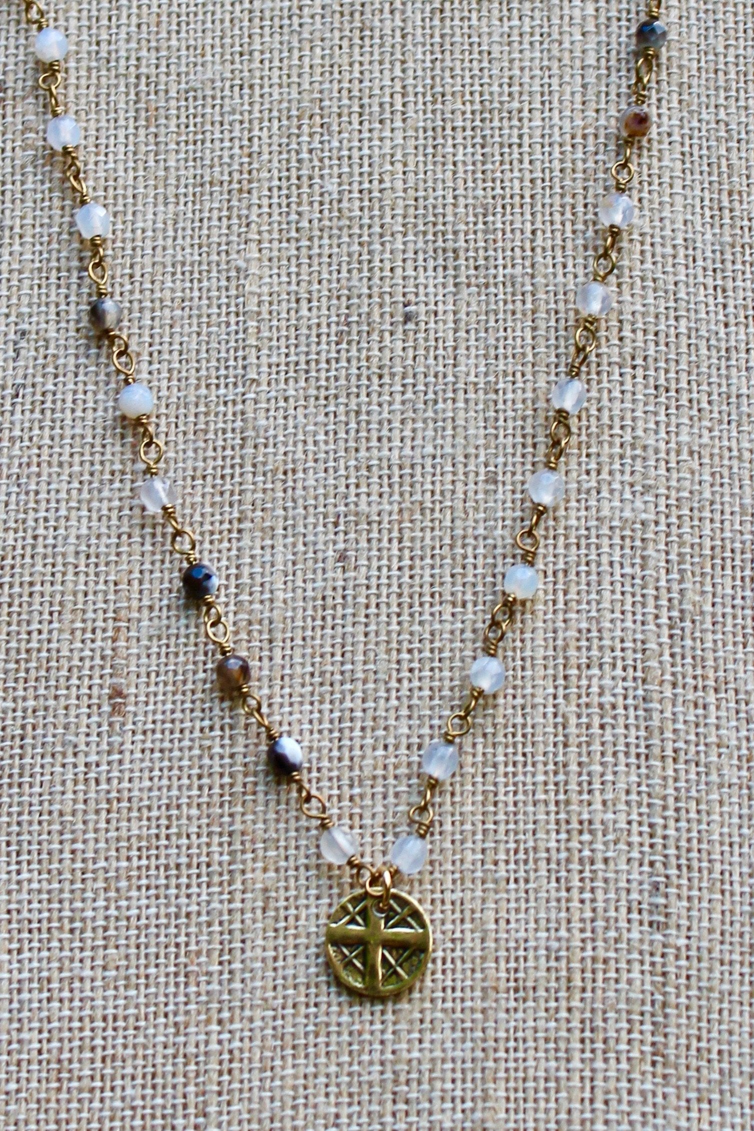 N140GB; Small Goldtone Round Cross ; 3mm Goldtone Black Agate Chain; Approximately 16 inches; ; ; ; Majestees