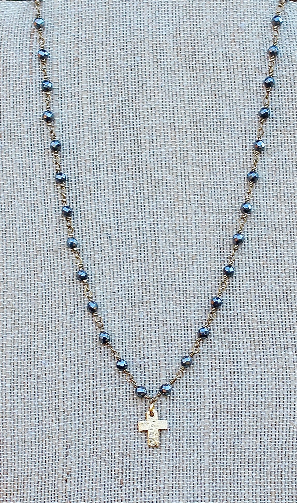 N141GH; Tiny Goldtone Cross; 3mm Goldtone Hematite Chain; Approximately 16 inches; ; ; ; Majestees